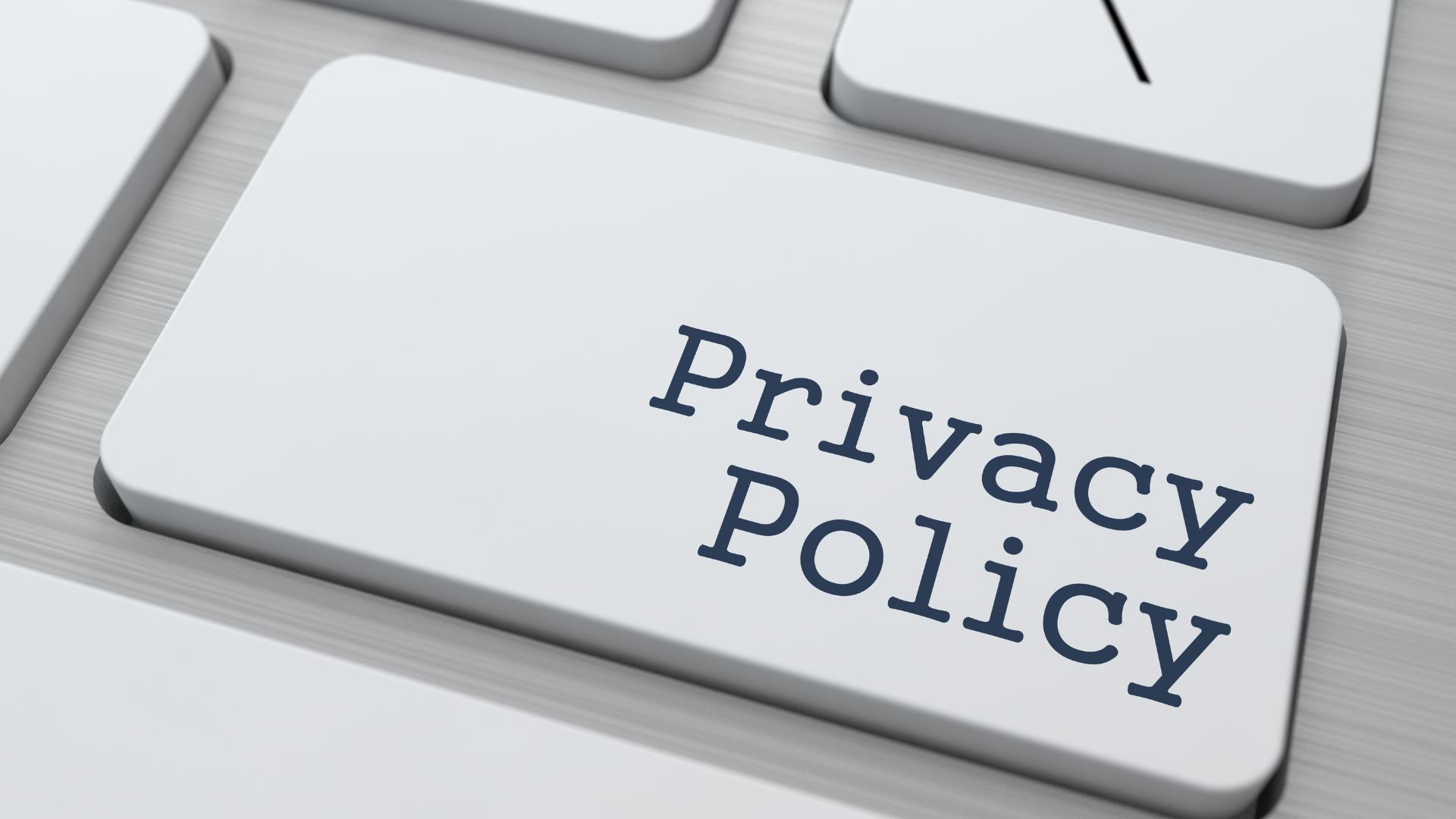 「Privacy Policy」と書かれたキーボードキーの画像|個情報保護方針の象徴